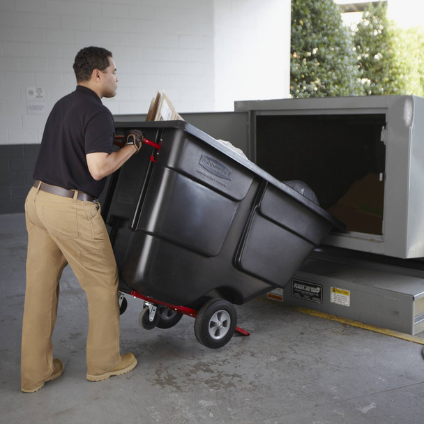 Worker Emptying Rubbermaid Utility Tilt Truck into Waste Compactor