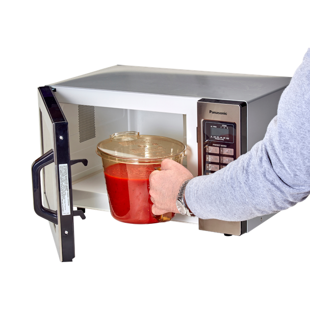 1.9L Cambro High Heat Measuring Jug Filled with Passate Being Removed from Microwave