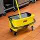 FGQ90088YEL - Rubbermaid HYGEN Microfibre Pad Press Wring Bucket with Wheels - Yellow - In Kitchen