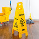 FG611477YEL - Rubbermaid 4-Sided "Caution" Safety Sign - 96.5cm - Yellow - Situated in a Room