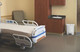 1883555 - White Rubbermaid Slim Jim Front Step Pedal Bin in hospital patient's room