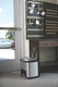 1901982 - A stainless steel Rubbermaid Slim Jim Front Step Pedal Bin situated under the key cupboard in the reception of a car valeting company