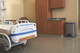 1901992 - A stainless steel Rubbermaid Slim Jim Front Step Pedal Bin situated in a hospital room