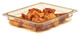 22HP150 - Amber coloured, plastic rectangular food pan containing breaded chicken