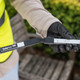 Person in Hi-Vis Vest & Wearing Gloves Puts Safe Pick Pro Folding Litter Picker into Straight Configuration