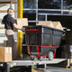 BRUTE Heavy-Duty Tilt Truck with DuraTilt Frame Being Used by a Man to Unload a Lorry