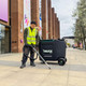 Ecogum Motorised Gum & Litter Removal Truck Being Used in a Retail Park by a Man Wearing a High-Vis Vest