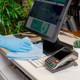 Spontex Blue MF Pro Recycled Microfibre Cloth Being Used by a Gloved User to Clean a Keyboard