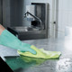 Ariane Ultra 1222 Microfibre Cloth Being Used to Wipe Down a Stainless Steel Countertop