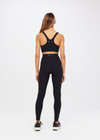 THE UPSIDE women's black Peached 28inch High Rise Pant is made from a recycled soft peached fabric with moisture-wicking, breathable and quick-drying properties.