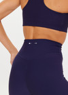 THE UPSIDE women's navy blue Peached 28inch High Rise Pant is a sustainable 28inch full length legging in our recycled soft peached fabric with a V shaped high-rise waistband.