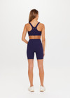 THE UPSIDE women's navy blue Peached Jade Bra is a sustainable scoop neck, full coverage T-back bra with internal elastic in the underbust and removable cups.