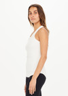 THE UPSIDE women’s white Frankie Rib Tank made with organic cotton elastane rib fabric features a racer back and scooped hems; ideal for yoga, pilates or barre.