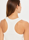 THE UPSIDE women’s white Frankie Rib Tank made with organic cotton elastane rib fabric features a racer back and scooped hems; ideal for yoga, pilates or barre.