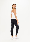 THE UPSIDE women's white Balance Seamless Lenny Tank made with Form Seamless fabric features a scoop neck, cross back straps, shelf bra and removable cups.