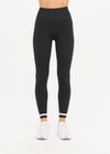 THE UPSIDE women's black mid-rise 25inch legging is made from our form seamless fabric with moisture control properties. It features a soft ribbed waistband and white stripe.