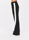 THE UPSIDE women's black Petra Flare is made from a lenzing viscose soft suiting fabrication. The full length tailored pant features side pockets and an elasticated waistband. Designed for walking and recovery.