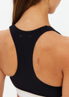 THE UPSIDE women's black Jagger Ness Racerback Bra is made from recycled sof peach with a brushed handfeel and moisture wicking, breathable and quick drying properties. This supportive, t back sports bra feature removable bust cups and discreet mesh pocket at the back. Designed for yoga, pilates and barre.