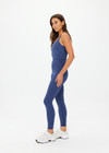 THE UPSIDE women's blue abstract print Farrow Lucia Scoop Crop is made from a recycled jacquard rib fabric with breathable, quick drying and moisture wicking properties. This crop top features a scoop neck and back, a shelf bra and removable cups. Designed for yoga, pilates and barre.