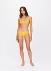 THE UPSIDE women's yellow marigold Dunes Olympia Pant is made from recycled textured rib fabric with moisture wicking properties. The low waisted, classic sporty swim bottom features an elasticated drawcord waist.