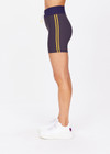 THE UPSIDE women's grey Dunes 5 inch Spin Short is made from recycled textured rib fabrication with moisture wicking properties. The mid-rise spin short are styled with yellow side stripes and drawcord through the waist. Designed for the gym.