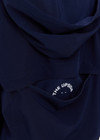THE UPSIDE women's navy Mansi Dawson Run Jacket is made in a light and breathable recycled fabric, featuring colours of green and white. The run jacket is water resistant and is fitted with elasticated cuffs with inner sleeve gloves and invisible zip pockets and a large back pocket for storing purposes. Designed for golf.