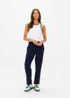 THE UPSIDE women's navy Mansi Paxton Tapered pant is made in recycled fabric to create a slim and lightweight effect. The tapered pant is water resistant and fitted with an elasticated waistband and front pockets. Designed for golf.