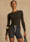 THE UPSIDE women's black Tyra Scoop Back Long Sleeve Top is a fitted long sleeve in soft modal rib with a scooped lower back. Designed for light movement such as yoga and walking.
