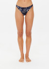THE UPSIDE women's floral batik print Gulf Christy Pant is made from soft recycled ribbed fabric. The low coverage bikini pant is fully lined.
