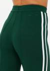 THE UPSIDE women's green Les Border Freya Knit Pant is made from a viscose blend. The knitted straight leg pant features a white side stripe and elasticated waistband for style and comfort. Designed for walking and recovery.