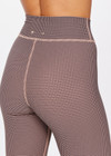 THE UPSIDE women's houndstooth check Bohemia 25 inch Midi Pant is made with recycled soft peached with a brushed handfeel, and moisture wicking, breathable and quick drying properties. This mid rise legging is designed for yoga, pilates and barre.