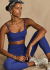 THE UPSIDE women's blue Carnaby Hutton Scoop Bra is made from a soft recycled ribbed fabrication. This scoop neck sports bra feature adjustable straps and removable bust cups and shelf bra. Designed for yoga, pilates and barre.