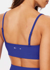 THE UPSIDE women's blue Carnaby Hutton Scoop Bra is made from a soft recycled ribbed fabrication. This scoop neck sports bra feature adjustable straps and removable bust cups and shelf bra. Designed for yoga, pilates and barre.