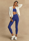 THE UPSIDE women's blue Carnaby 25 inch Midi Pant is made from a soft recycled ribbed fabrication. This mid rise legging features a soft folded waistband and is designed for yoga, pilates and barre.