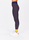 THE UPSIDE women's yellow Dunes 25 inch Midi Pant is made from recycled textured rib fabrication with moisture wicking properties. The mid-rise pant is styled with navy and yellow for style and an elasticated drawcord through the waist for the perfect fit. Designed for the gym.