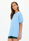 THE UPSIDE women's blue One Love Club Sammi Tee is made from organic cotton. The oversized tee features a soft rib neck lining for a lived in feel. Designed for tennis.