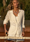 THE UPSIDE women's white Lavalliere Malia Knit Shirt is made from organic cotton. The long sleeve knit shirt features an open lace knit construction with bow knitted detailing and fitted with buttons and a ribbed collar. Designed leisure and recovery.