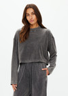 THE UPSIDE women's grey Soho Cropped Long Sleeve Top is made from soft brushed recycled cotton. This drop shoulder crop top features a ribbed mock neck and was designed for a relaxed fit.