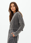 THE UPSIDE women's grey Soho Cropped Long Sleeve Top is made from soft brushed recycled cotton. This drop shoulder crop top features a ribbed mock neck and was designed for a relaxed fit.