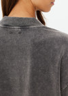 THE UPSIDE women's grey Soho Cropped Long Sleeve Top is made from soft brushed recycled cotton. This drop shoulder crop top features a ribbed mock neck and was designed for a relaxed fit.