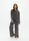 THE UPSIDE women's grey Soho Cropped Long Sleeve Top is made from soft brushed recycled cotton. This drop shoulder crop top features a ribbed mock neck and was designed for a relaxed fit.