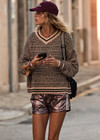 THE UPSIDE women's neutral abstract print Castilla Millie Knit Sweater is made with an organic cotton blend knit jacquard. This relaxed knitted sweater features a high neckline with striped rib. Designed for everyday wear.