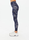 THE UPSIDE women's floral batik print Gulf 25 inch Midi Pant is made from soft recycled ribbed fabric. The mid rise legging features a soft folded waistband.