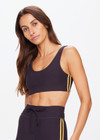 THE UPSIDE women's black Beaufort Harley Scoop Bra is made from recycled soft peached fabrication with a brushed handfeel for a breathable and quick drying effect. The sports bra has a scoop front and back neckline and elasticated underbust with removable cups for comfort and yellow stripes down the side for style. Designed for the gym and running.