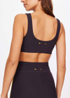 THE UPSIDE women's black Beaufort Harley Scoop Bra is made from recycled soft peached fabrication with a brushed handfeel for a breathable and quick drying effect. The sports bra has a scoop front and back neckline and elasticated underbust with removable cups for comfort and yellow stripes down the side for style. Designed for the gym and running.