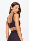 THE UPSIDE women's black Beaufort Harley Scoop Bra is made from recycled soft peached fabrication with a brushed handfeel for a breathable and quick drying effect. The sports bra has a scoop front and back neckline and elasticated underbust with removable cups for comfort and yellow stripes down the side for style. Designed for the gym and running.