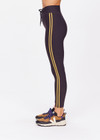 THE UPSIDE women's black Beaufort 25 inch Midi Pant is made from recycled soft peached fabrication with a brushed handfeel for a breathable and quick drying effect. The mid rise pant features an elasticated drawcord for the perfect fit and yellow stripes down the side for style. Designed for the gym and running.