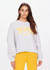 THE UPSIDE women's grey Harbor Paloma Cropped Crew is made from organic cotton. The oversized crew features a ribbed neckline, cuffs and hem and a drop shoulder for a relaxed look. Designed for recovery and leisure.