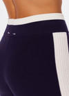 THE UPSIDE women's navy Montage Speechless Short is a knitted short with cream side panels and soft waistband for comfort. Designed for light movement and recovery.