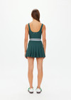 THE UPSIDE women's green Peached Lucette Pleated Dress is made in a recycled soft peached fabric with a brushed handfeel for a breathable and quick drying effect. The panelled mini dress is fitted with a pleated skirt and straight back straps with a scooped neckline for style and built in shorts and internal shelf bra for practicality and comfort. Designed for Tennis.